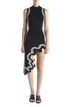 Model wears Black PH5 wavy hem asymmetric dress with white outline.