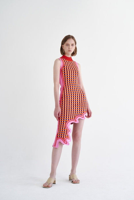 Model wearing PH5 pink checkered wavy hem asymmetrical dress.